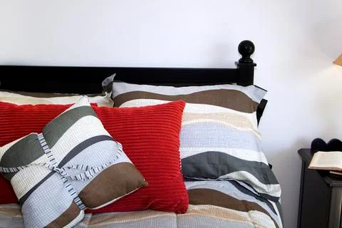 Close up on a bed in a bedroom Stock Photos