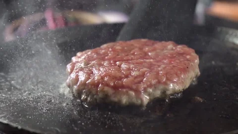 Close-up of beef meat for a burger is fried in a hot pan Video stock 105031755