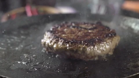 Close-up of beef meat for a burger is fried in a hot pan 스톡 동영상 105031777