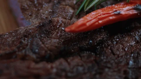 Close up beef steak cooked medium well cut sliced knife on a cutting board roast Stock Footage 100305080