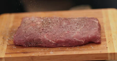 Close-up of a beef steak on a wooden board Stock Footage 258648297