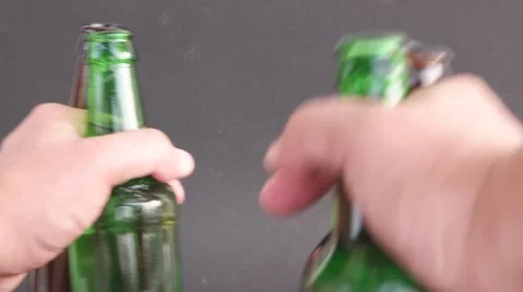 Close up of beer bottles in a man's hands Stock Footage 68769029