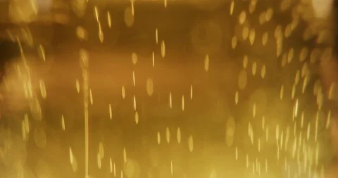 Close up of beer bubbles. Cold Light Beer 4K. Abstract golden particles. Stock Footage 115955699