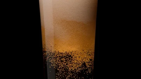 Close-up beer in glass. Bubbles rising. Slow Motion. Stock Footage 72853069