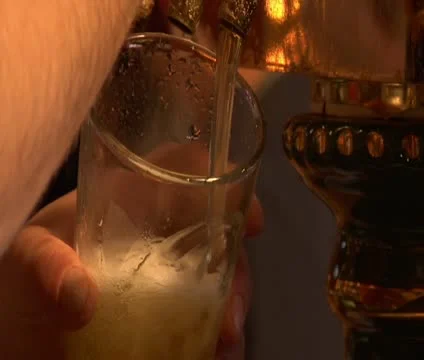 Close-up of beer pouring from tap Stock Footage 21636506