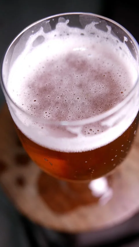 Close-up of a beer on the table (slowly zooming out). Beer glass. Bubbles rising Stock Footage 337926869