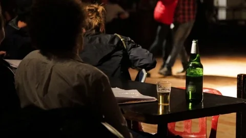 Close Up of Beer w/ Tango Dances in Background Stock Footage 72935549