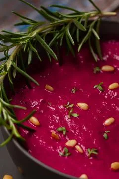 Close up of a beetroot soup with pine nuts Stock Photos