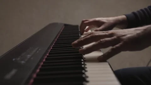 Close-up of beginner pianist practicing on a electronic piano keyboard Stock Footage 342237090