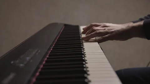 Close-up of beginner pianist practicing on a electronic piano keyboard Stock Footage 342237134