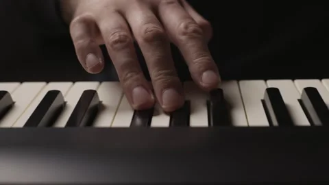 Close-up of beginner pianist practicing on a electronic piano keyboard Video stock 342237216