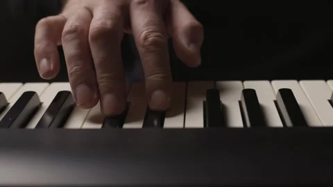 Close-up of beginner pianist practicing on a electronic piano keyboard Stock Footage 342237217