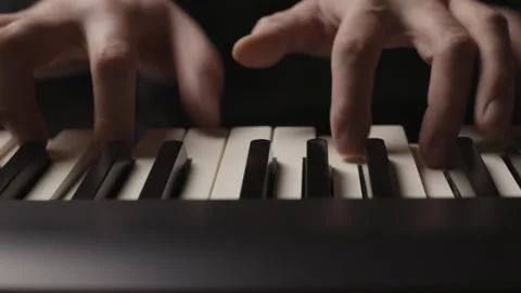 Close-up of beginner pianist practicing on a electronic piano keyboard Stock Footage 342237248