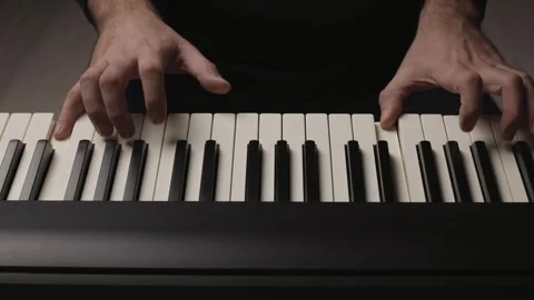 Close-Up of Beginner Pianist Practicing on an Electronic Piano Keyboard Stock Footage 342237952