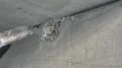 Close Up of Beginning Concrete Wall Demolition with Hammer Vídeos de archivo 346710013