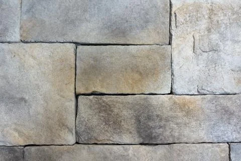 Close-Up of Beige and Gray Castle Stone Wall Texture with Natural Masonry P.. Stock Photos