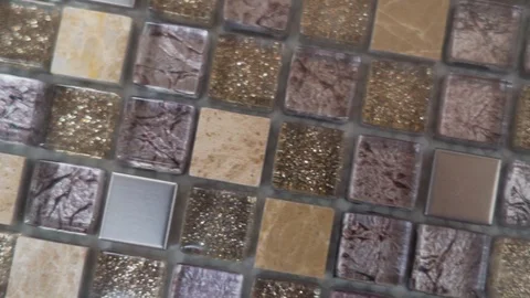 Close up of beige and gray tones square ceramic mosaic tiles on kitchen apron or Stock Footage 118818191
