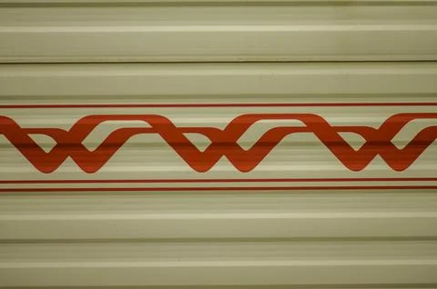 Close Up of Beige Corrugated Surface with Red Geometric Pattern Stock Photos