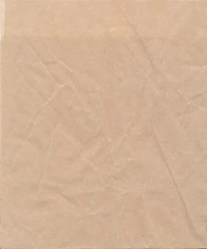 Close up of beige crumpled paper texture background. Wrapping. Stock Photos