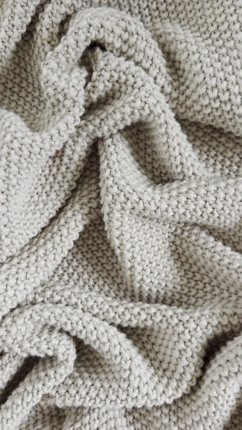  Close up beige knitted blanket texture background. Warm autumn , winter wool bl Stock Footage 340842297