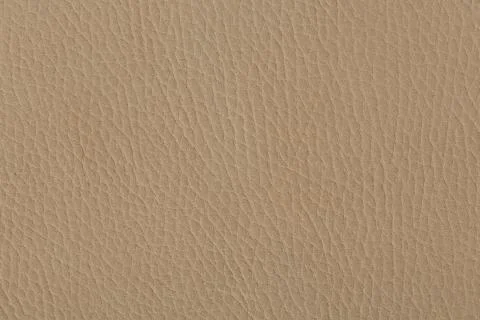 Close up of a beige leather texture. Stock Photos