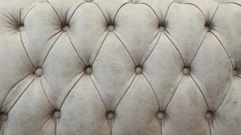 Close-up of beige textured tufted couch upholstery background showing detai.. Stock Footage 335158019