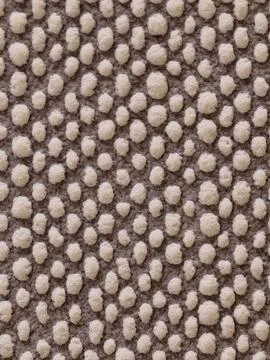 Close-up of beige tufted carpet texture with raised loops Foto stock
