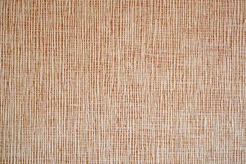 Close-up of beige woven texture background. Stock Photos