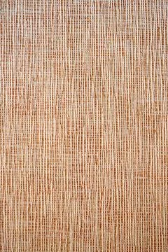 Close-up of beige woven texture background. Stock Photos