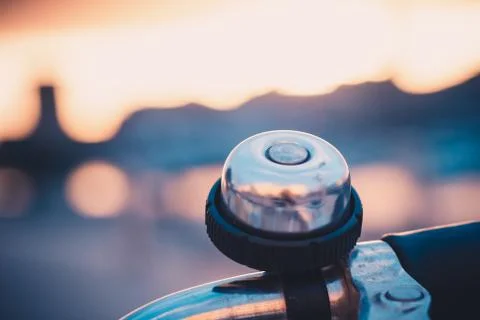 Close-up of a bell ringer on the handle bars of bicycle in the old harbor of  Stock Photos