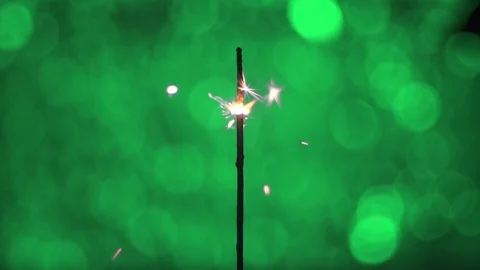 Close-up, Bengal fire sparks floating on a green background 스톡 동영상 121843499