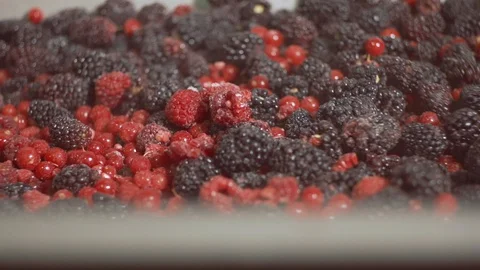 Close up of berries being mixed together in slow motion, Portugal Stock Footage 128960754