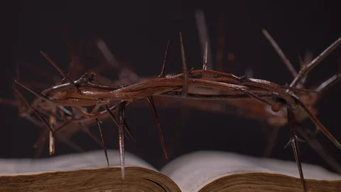 Close Up of Bible and Crown of Thorns Rotating Video stock 129642864