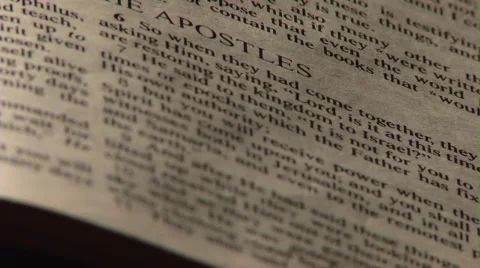 Close up of Bible Page - Acts 1 - Roll Focus - 720p 動画素材 45321832