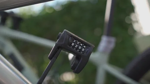 Close-up of bicycle folding lock with number combination security on cycle Video stock 222413487