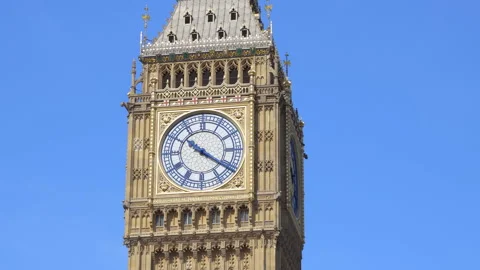 Close-up of Big Ben clock face under bright sunlight in London on a sunny day  Stock Footage 320333943