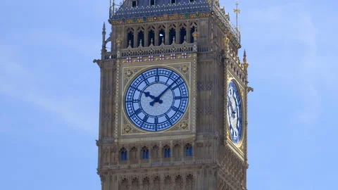 Close-up of Big Ben clock tower under a clear blue sky in London, UK  Stock Footage 320298270