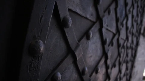 Close-up of big black iron gate. Historic, ancient, entrance, religion, row Stock Footage 100126864