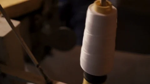 Close-up of big bobbin with white thread for packing grain in bags 스톡 동영상 98126476