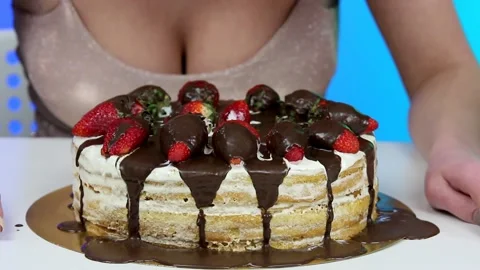 Close-up of a big cake with cream and strawberries. Stock Footage 160365062