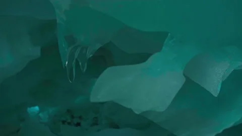 Close-up big icicles on rocks of natural glacier and amazing landscape on the Stock Footage 324109006