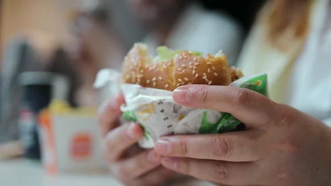 Close up of big juicy beef burger in hands. Stock Footage 336556564