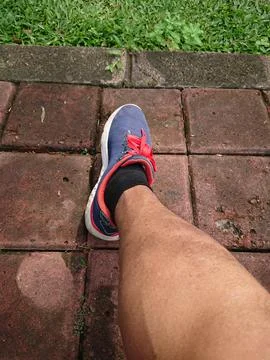 Close up, Big Man Leg Using Blue Sport Shoes Stock Photos