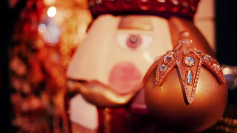 Close up of a big nutcracker figurine with blurry lights on the background Stock Footage 297542301