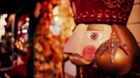 Close up of a big nutcracker figurine with blurry lights on the background Stock Footage 297542458