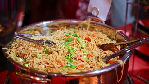 Close up of big pot with pasta and veggies at a food station during a banquet Stock Footage 342699140