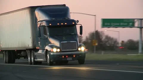 Close up of Big Rig Truck passing from shoulder of Freeway along Interstate 5 HD Stock Footage