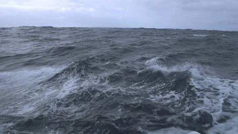 Close up of big waves splashing in stormy ocean in slow motion Stock Footage 138892726