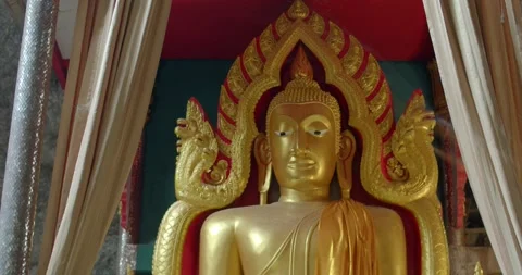 Close up big yellow Buddha statue in a cave.Buddha in Thailand. Stock Footage 270576547