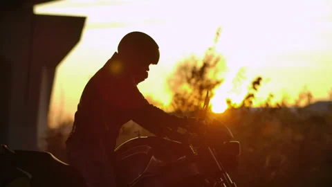 Close-up Biker Man Walking Through Parking to his Standing Motorcycle Silhouette Stock Footage 142157633